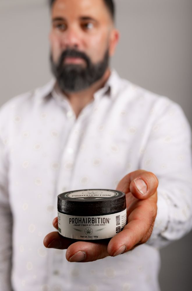 Barber hand holding product